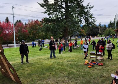 Visitors outside at the Fall Carnival taking part in activities
