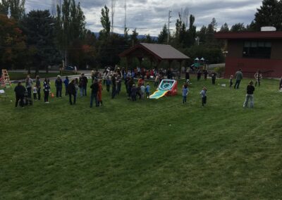 Visitors on the lawn at the Fall Carnival taking part in activities