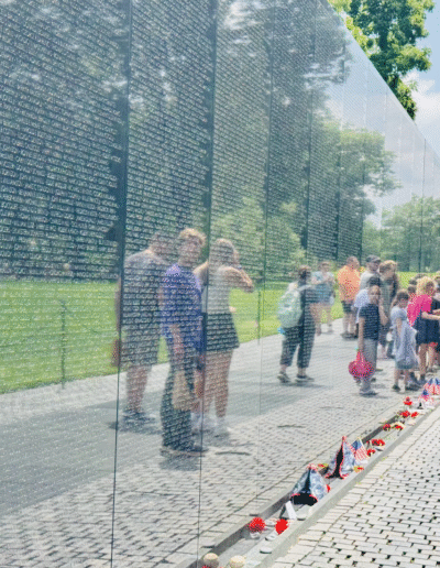 Bigfork High School students looking at the names displayed on the wall of the Vietnam Veterans Memorial in Washington D.C.