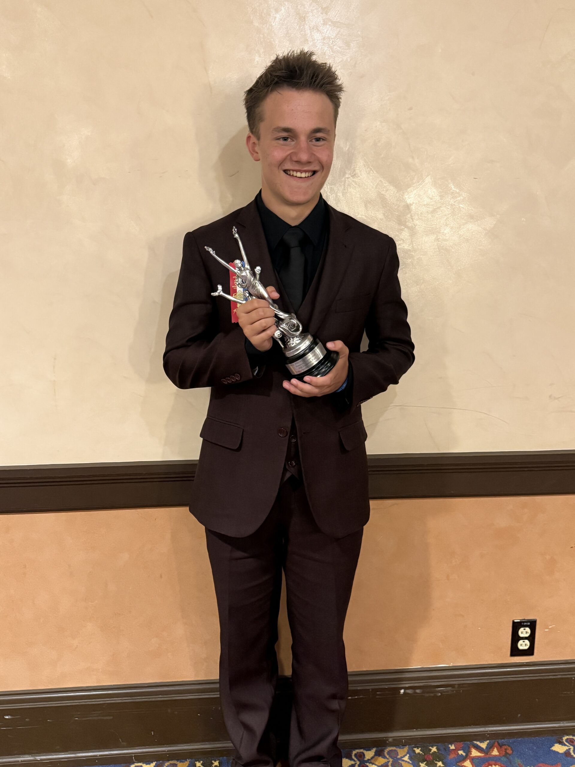 Speech and Debate student with award at nationals. 